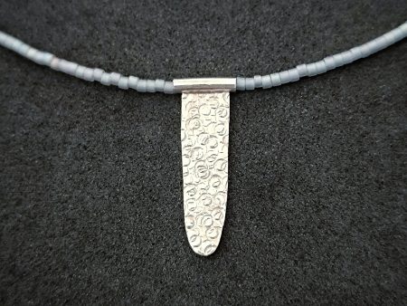 Silver pendant with glass beads