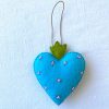Beautiful the 'All-Seeing Heart' Ornament: A sea-blue heart ornament. - Image 4