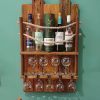 Rustic, repurposed pine and rope wall-mounted bottle rack with wine glass shelf
