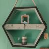 Hexagonal hanging display with pallet block shelf