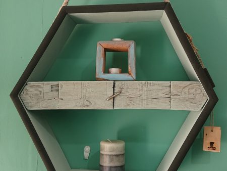 Hexagonal hanging display with pallet block shelf