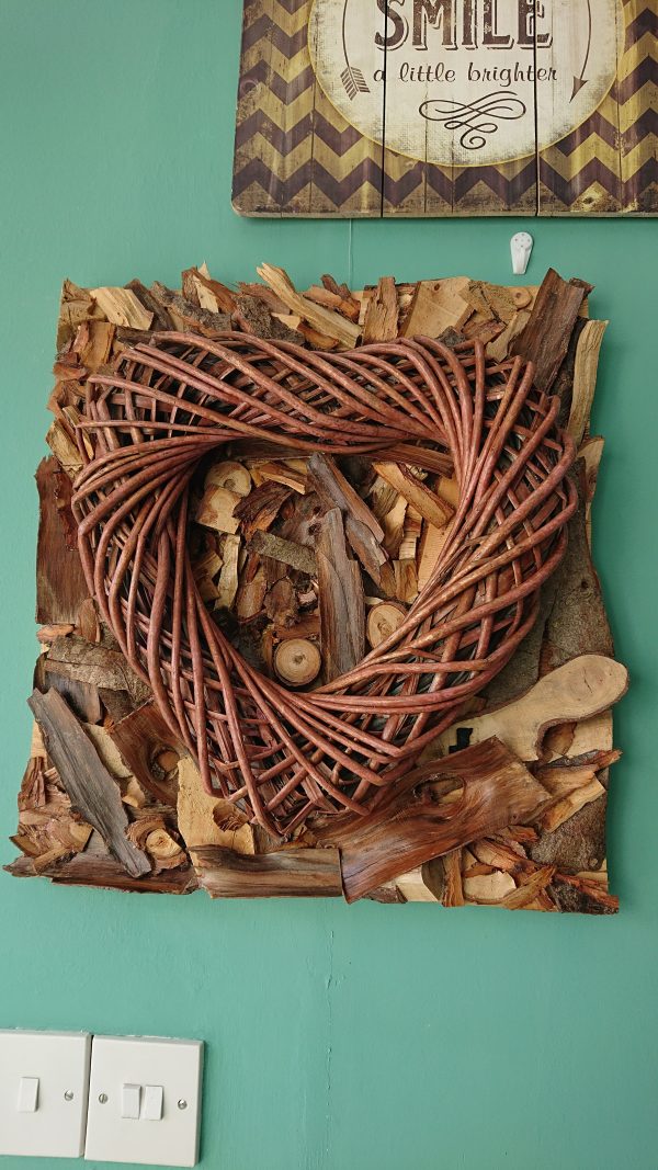 Wood log shavings with bamboo heart wall art feature