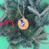 Pebble Ornaments On Wood Slices - Image 25