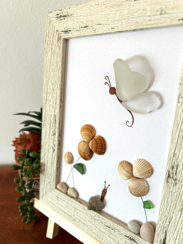 A lovely scene with a butterfly, snail, and flowers, made with seaglass and seashells, perfect as a unique gift! - Image 6
