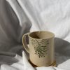 Ceramic mug with real leaves imprint