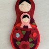 Adorable mum and baby felt nesting dolls