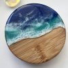 Ocean inspired resin and wood fridge magnet bottle opener.
