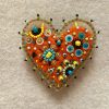 Adorable handmade orange heart magnet