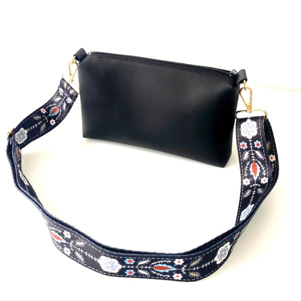 black messenger bag with bohemian strap front