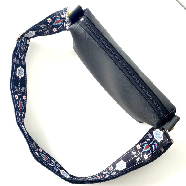 black messenger bag with bohemian strap top