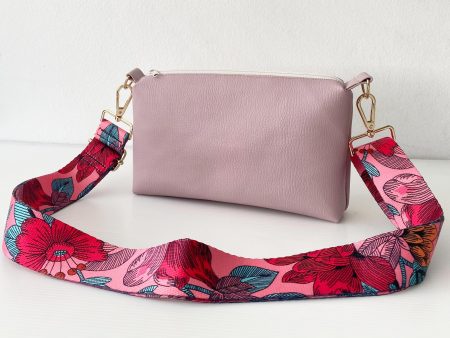 pink messenger bag with floral strap front