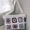White granny square crochet bag with magnetic closure and felt lining