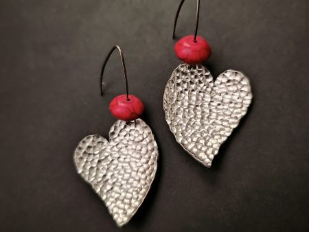 Heart hammered earrings with red howlite stones