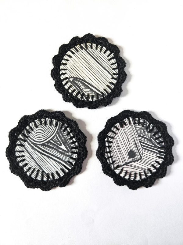 the "Electric suns" double-sided handcrafted crochet coasters - set of 3 // b&w wood side