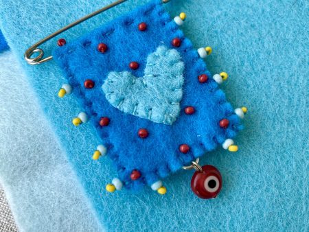 Blue Felt Love Pin with a Evil Eye Charm – Handmade Beaded Brooch for Good Luck and Protection.