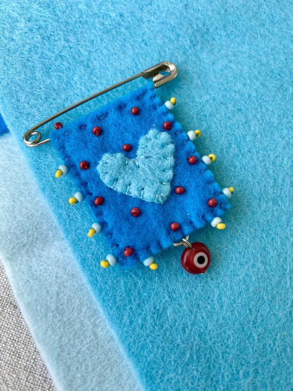 Blue Felt Love Pin with a Evil Eye Charm – Handmade Beaded Brooch for Good Luck and Protection.
