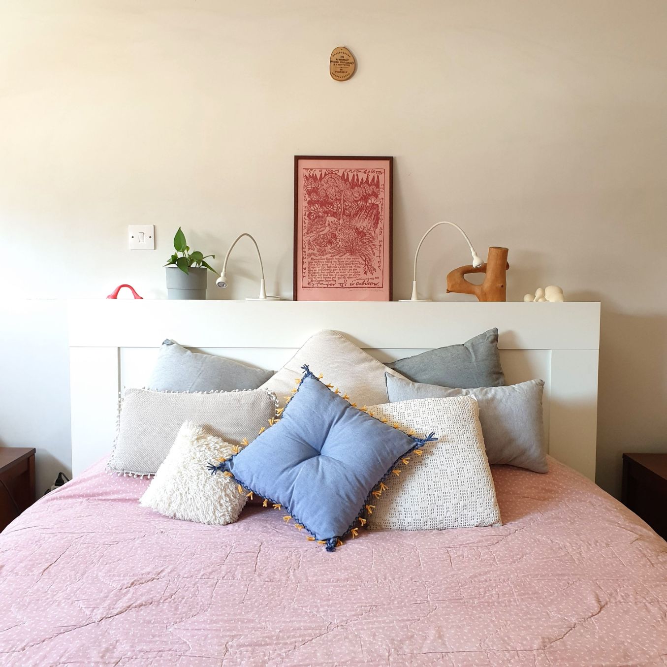 "Spiky consolation" blue & yellow comfort cushion - in use bedroom