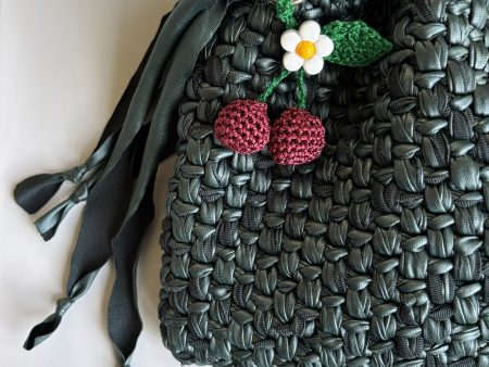 Blossoming cherry bag charm on handbag