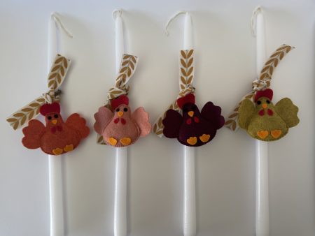 Easter candles with handmade felt hen ornaments