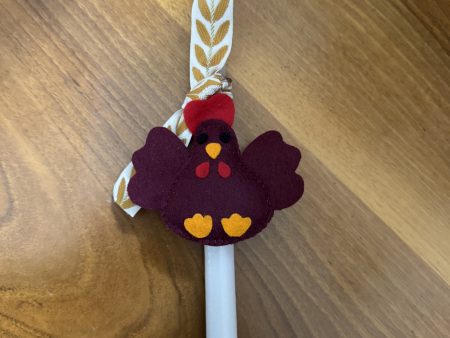 Easter candles with handmade felt hen ornaments