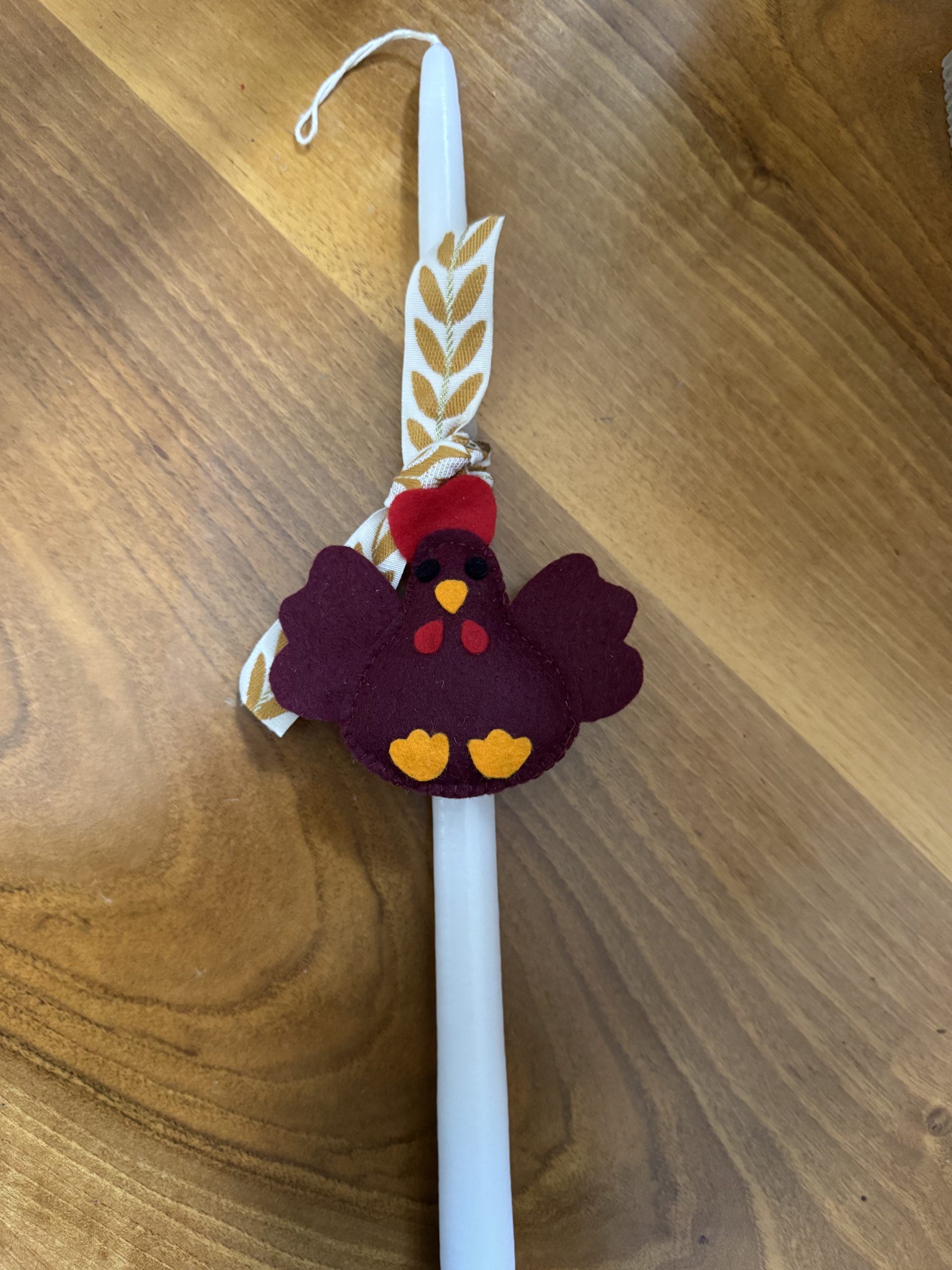 Easter candles with handmade felt hen ornaments